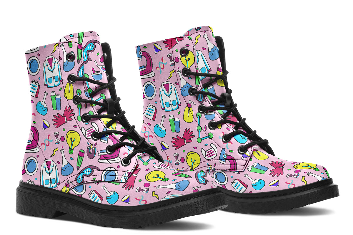 Pink boots featuring a pattern of various STEM icons, such as microscopes, lab coats, DNA helix, microscopes, gloves and beakers. 