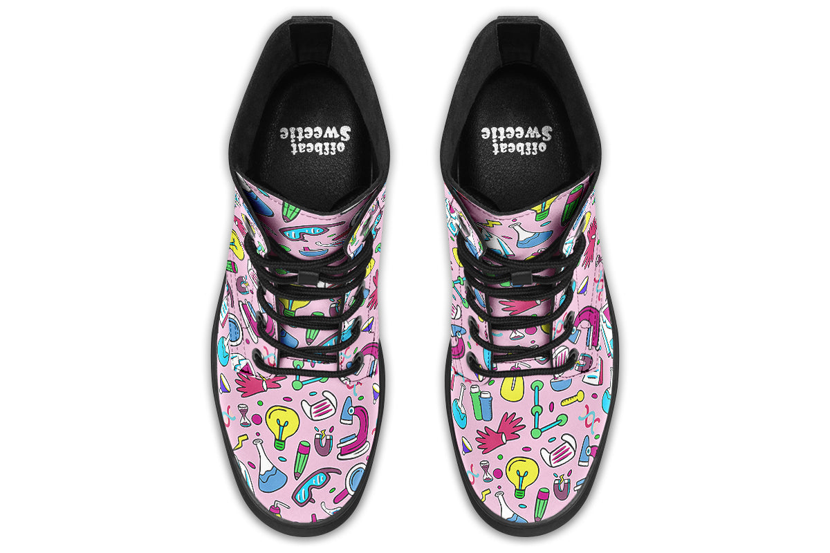 Pink boots featuring a pattern of various STEM icons, such as microscopes, lab coats, DNA helix, microscopes, gloves and beakers. 