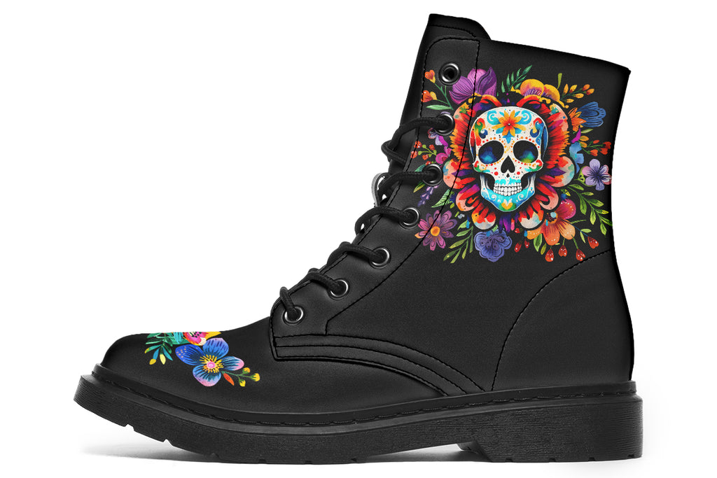 Black boots with a sugar skull design on each side, with a floral and dotted pattern on the skull and different colours flowers coming out from behind the skull. The toes of the boots feature a matching flower design.