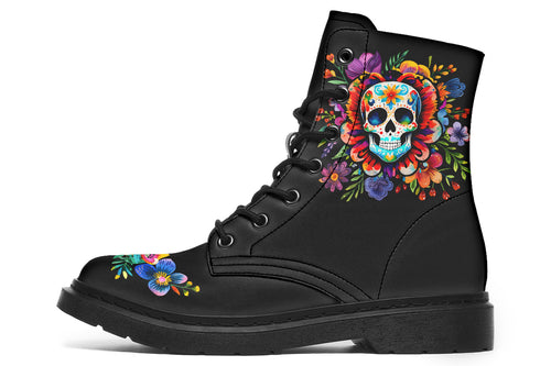 Black boots with a sugar skull design on each side, with a floral and dotted pattern on the skull and different colours flowers coming out from behind the skull. The toes of the boots feature a matching flower design.