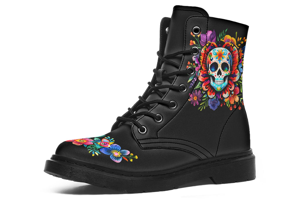 Black boots with a sugar skull design on each side, with a floral and dotted pattern on the skull and different colours flowers coming out from behind the skull. The toes of the boots feature a matching flower design.