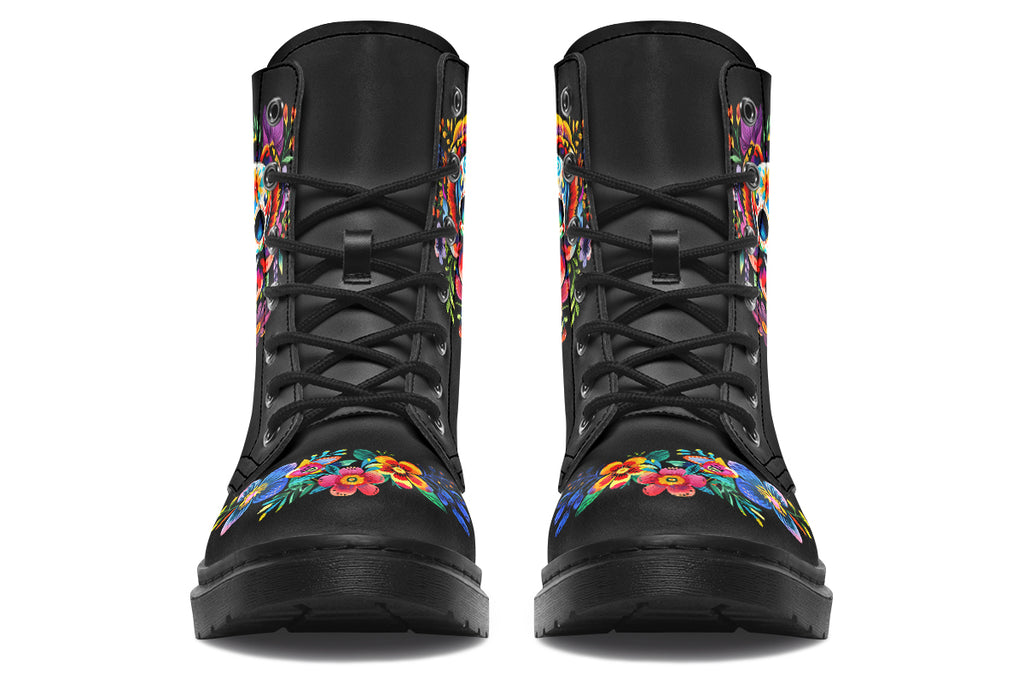 Black boots with a sugar skull design on each side, with a floral and dotted pattern on the skull and different colours flowers coming out from behind the skull. The toes of the boots feature a matching flower design.