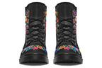 Black boots with a sugar skull design on each side, with a floral and dotted pattern on the skull and different colours flowers coming out from behind the skull. The toes of the boots feature a matching flower design.