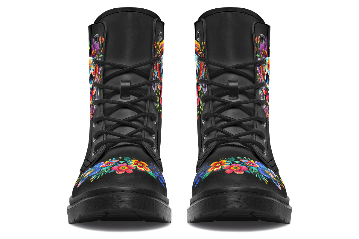 Black boots with a sugar skull design on each side, with a floral and dotted pattern on the skull and different colours flowers coming out from behind the skull. The toes of the boots feature a matching flower design.