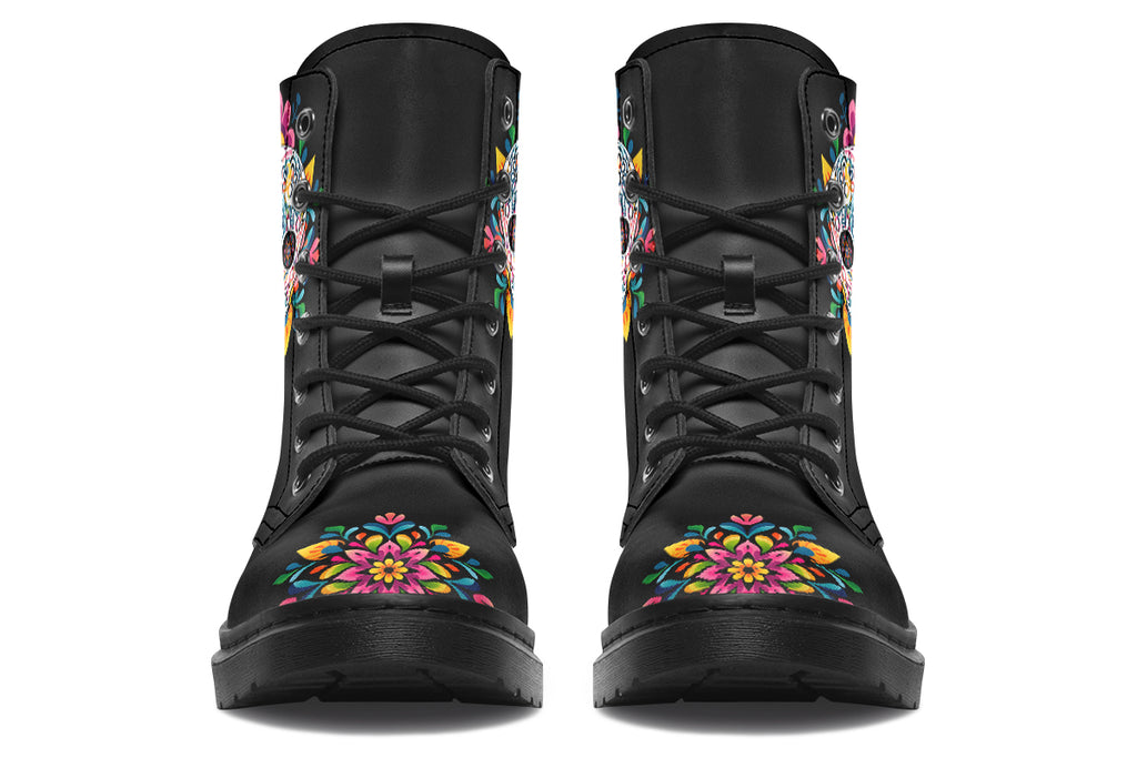 Black boots with a sugar skull design on each side, with a rainbow pattern on the skull and different colours flowers coming out from behind the skull. The toes of the boots feature a matching flower design.