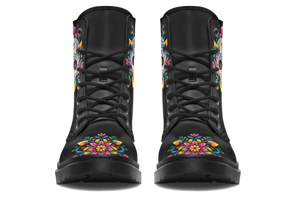 Black boots with a sugar skull design on each side, with a rainbow pattern on the skull and different colours flowers coming out from behind the skull. The toes of the boots feature a matching flower design.