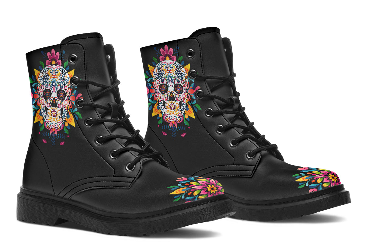 Black boots with a sugar skull design on each side, with a rainbow pattern on the skull and different colours flowers coming out from behind the skull. The toes of the boots feature a matching flower design.