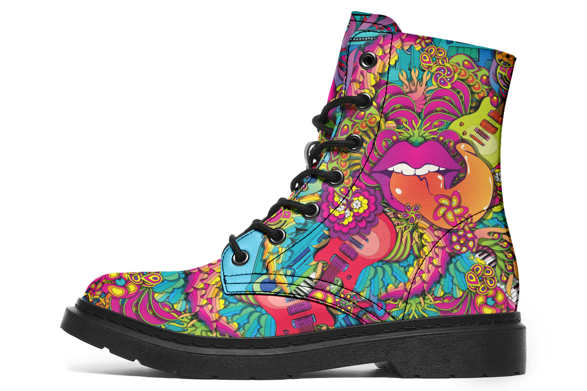 Vibrant, colourful mismatched boots in a design that’s reminiscent of a midcentury psychedelic album cover. The right boot features a peace sign with a flower-patterned guitar in it, surrounded by colourful flowers, a second guitar and other decorative patterns. The left boot features pink lips with a long tongue coming out of them which almost looks like it is licking the guitar next to it. The design has another guitar down the bottom and a busy pattern of colourful florals and swirls.