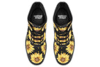 Black boots with a yellow sunflower pattern, with yellow polka dots