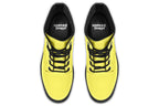 Bright yellow boots with a black sole.