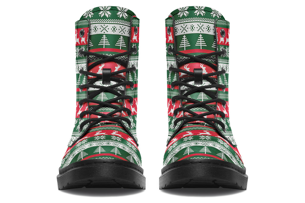 Boots with a red, white and green Christmas pattern in the style of “ugly Christmas sweaters”. The pattern features reindeers, snowflakes and Christmas trees.