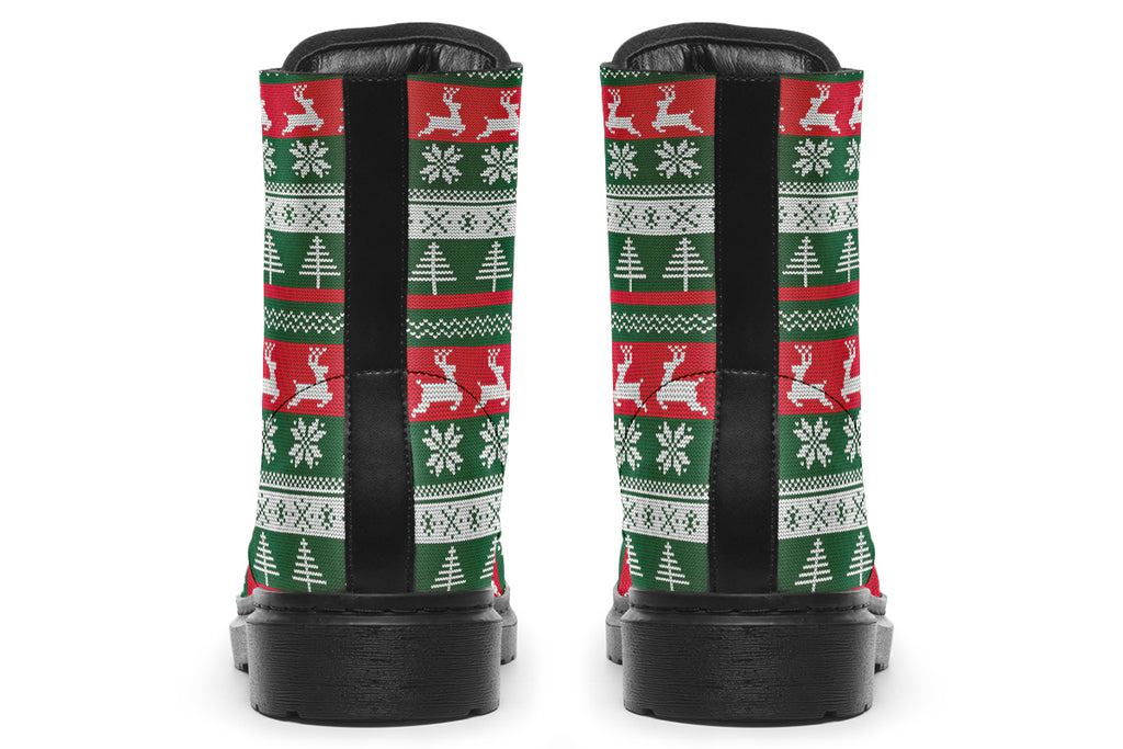 Boots with a red, white and green Christmas pattern in the style of “ugly Christmas sweaters”. The pattern features reindeers, snowflakes and Christmas trees.