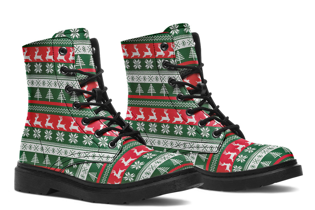 Boots with a red, white and green Christmas pattern in the style of “ugly Christmas sweaters”. The pattern features reindeers, snowflakes and Christmas trees.
