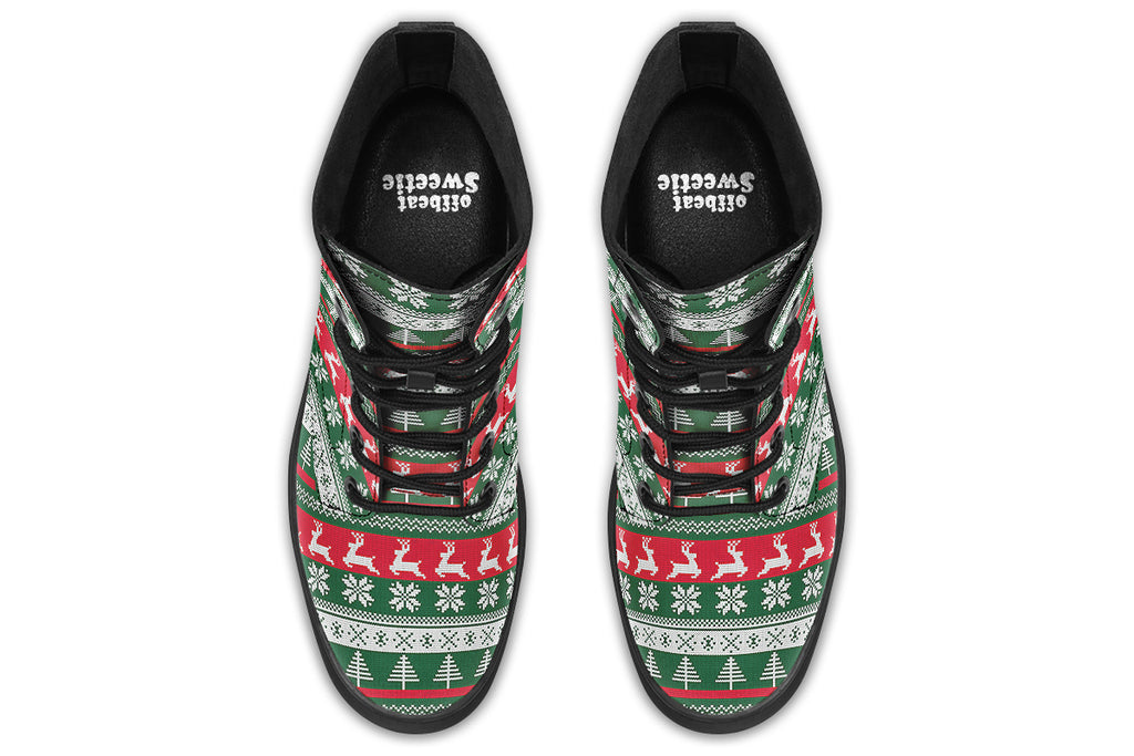 Boots with a red, white and green Christmas pattern in the style of “ugly Christmas sweaters”. The pattern features reindeers, snowflakes and Christmas trees.