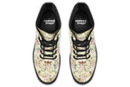 Yellowish/beige coloured boots featuring a vintage-looking pattern of dragonflies and pink and white flowers.