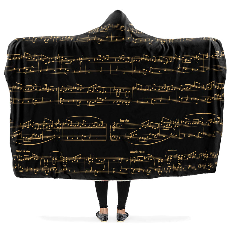 Hooded blanket with gold musical notes on black background