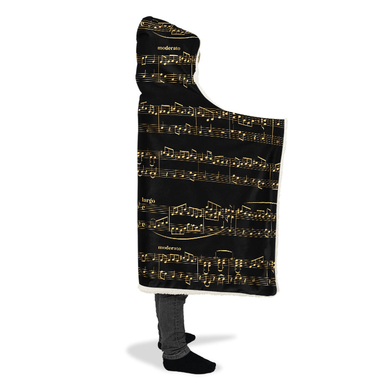 Hooded blanket with gold musical notes on black background