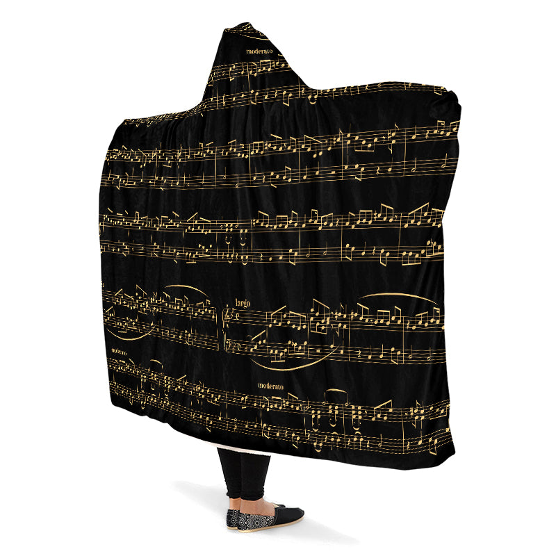 Hooded blanket with gold musical notes on black background
