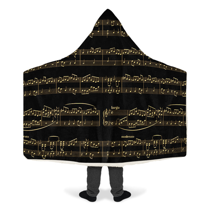 Hooded blanket with gold musical notes on black background