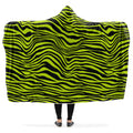 Person wearing a green and black zebra patterned hooded blanket.