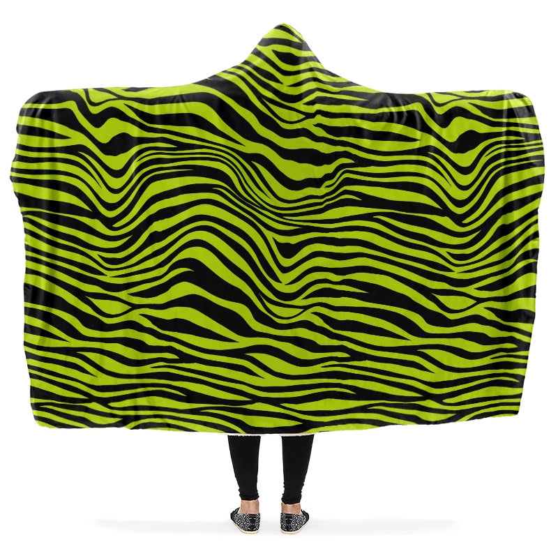 Person wearing a green and black zebra patterned hooded blanket.
