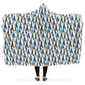 Hooded blanket with penguin pattern on a light blue background