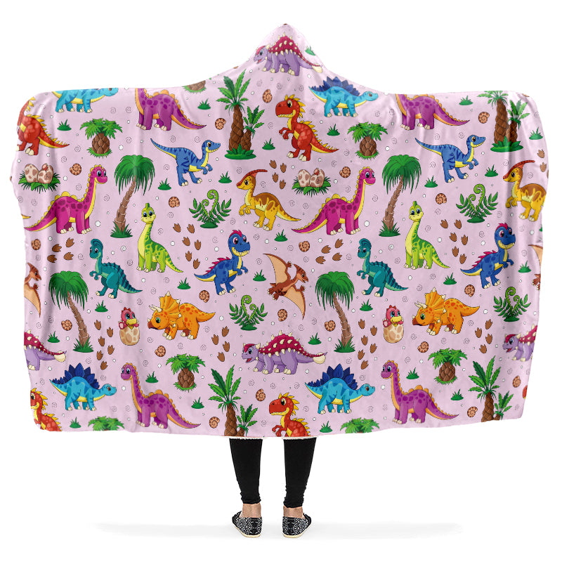 Hooded blanket with colorful dinosaur pattern on a pink background