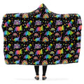 Hooded blanket with colorful dinosaur and rainbow pattern on a black background