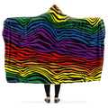 Colorful wavy zebra stripe patterned hooded blanket draped over a person.