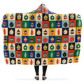 Hooded blanket with colorful geometric Christmas bauble pattern.