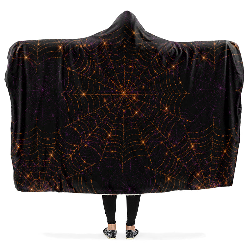 Black hooded blanket with bronze spider web pattern.