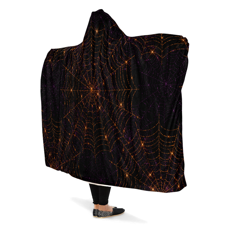 Black hooded blanket with bronze spider web pattern.