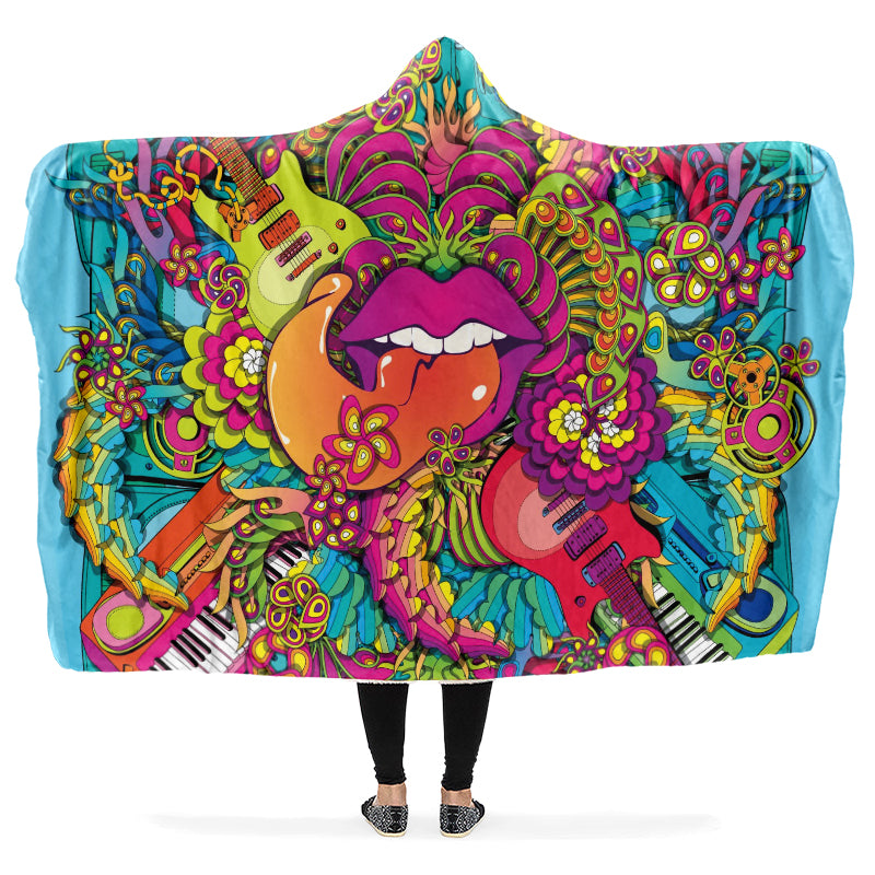 Colorful hooded blanket with a psychedelic design featuring guitars, flowers, and lips with the tongue sticking out. 