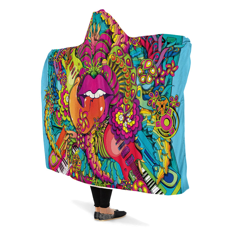 Colorful hooded blanket with a psychedelic design featuring guitars, flowers, and lips with the tongue sticking out. 