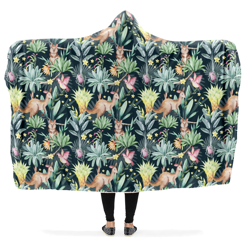 Hooded blanket with an Australian animal pattern on a dark green background. The animals are kangaroos, quokkas and cockatoos.