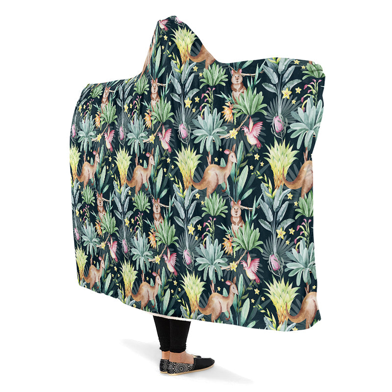 Hooded blanket with an Australian animal pattern on a dark green background. The animals are kangaroos, quokkas and cockatoos.