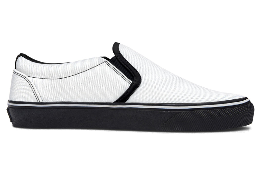 Black and White Mismatch Slip Ons
