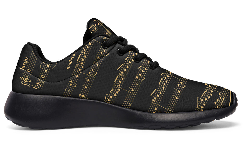 Black sneakers with gold musical note pattern on a white background