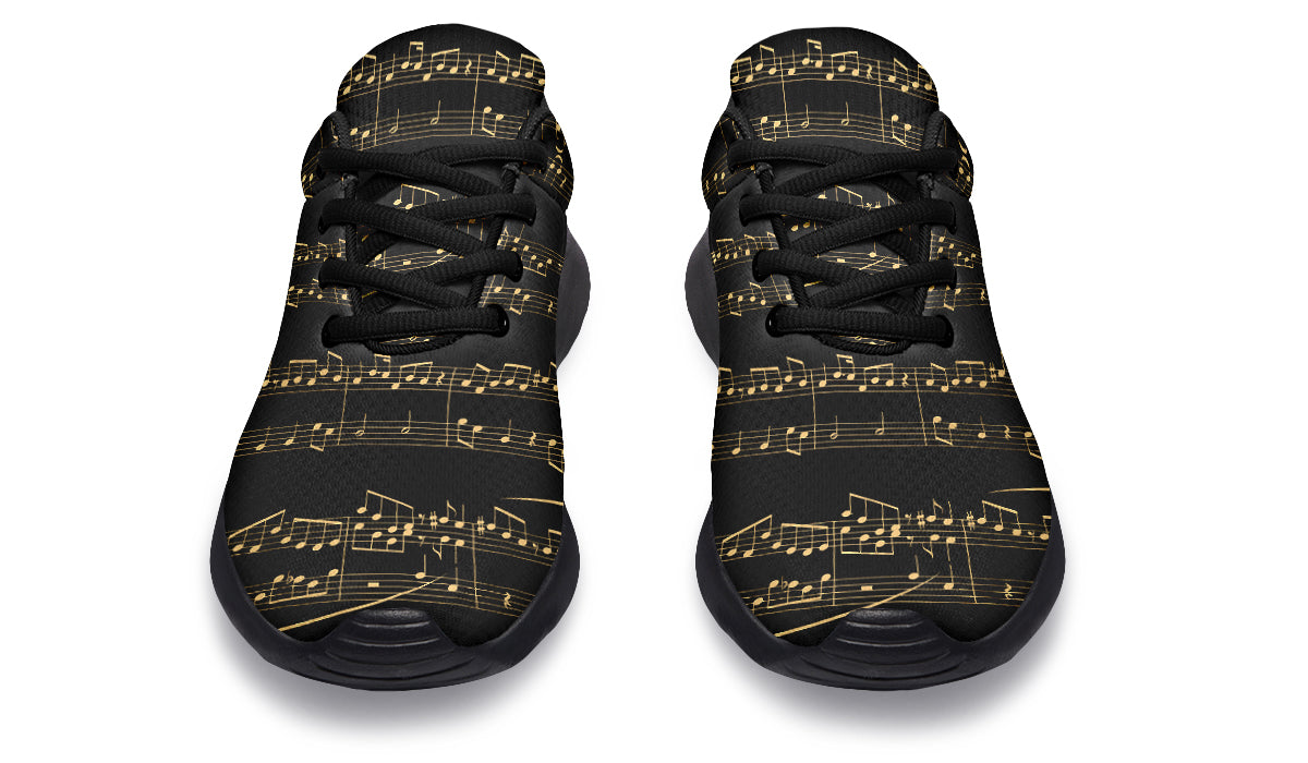 Black sneakers with gold musical note pattern on a white background