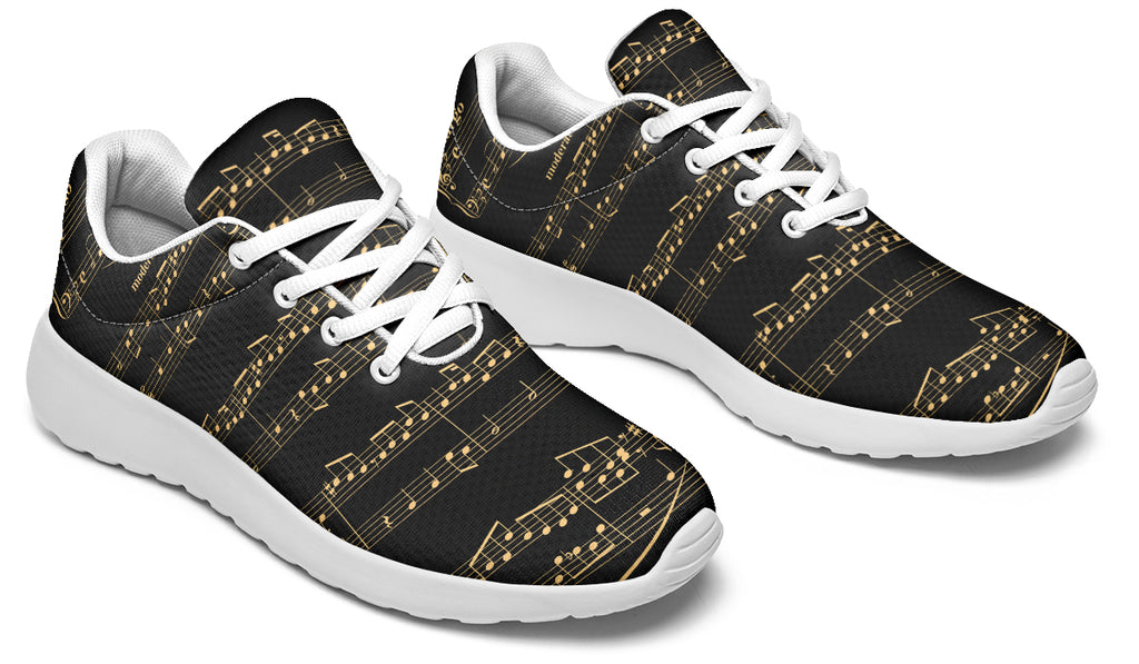 Black sneakers with gold musical note pattern on a white background